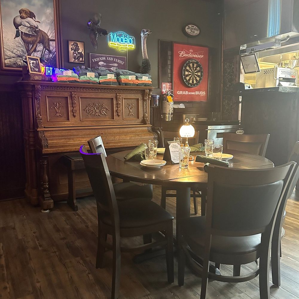 Dining room with antique piano at Poor Parson's Pub